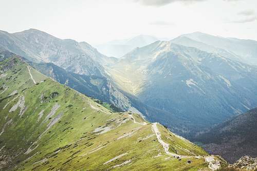 mountain range mountains during daytime peak